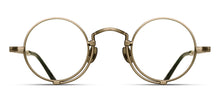 Load image into Gallery viewer, A gold optical glasses frame is pictured. The glasses have a round lens shape and feature an engraving along the rim wire.
